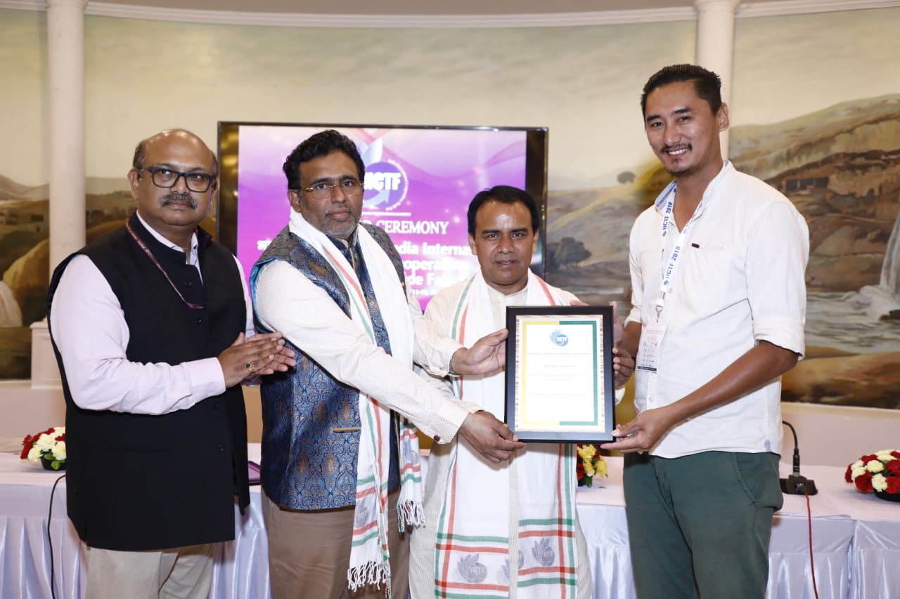 India International Cooperative Trade Fair_ Cekrozuve Krotho Weaving & Industrial Coop. Society Ltd. receiving Excellence Award